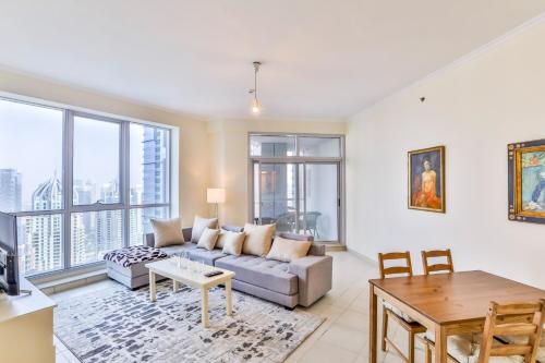 a living room with a couch and a table at 2BR High Floor Torch Tower Dubai Marina in Dubai