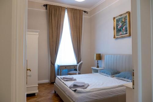 Ліжко або ліжка в номері Apartament Alma