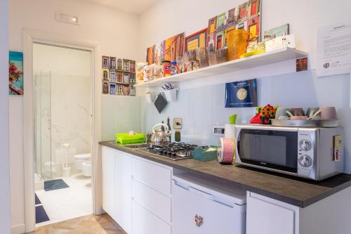 A kitchen or kitchenette at Il Balcone Sui Presepi Apartment