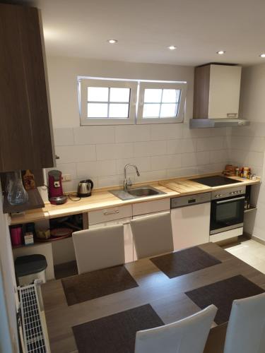 a kitchen with a sink and a counter top at Wohnung, Zimmer in Frankfurt Flughafen zu vermieten in Mörfelden-Walldorf