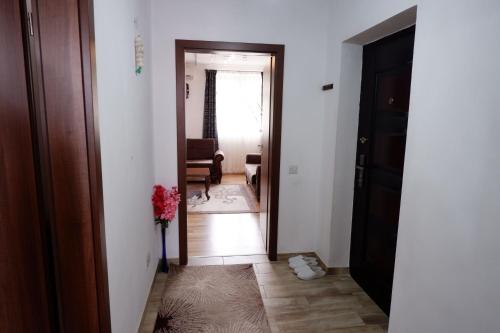 a hallway with a door leading to a living room at Hotel Kings Apartments in Kolgecaj