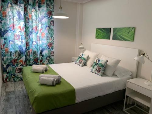 a bedroom with a bed with two pillows on it at APARTAMENTO ALEGRIA CENTRO in Albacete