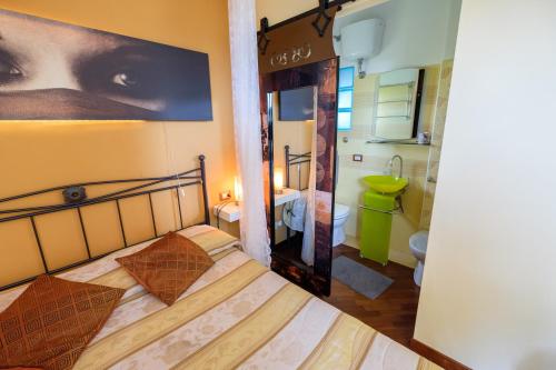 Cama ou camas em um quarto em Axia Terme B&B, 4 min dal Centro Storico - PARK privato