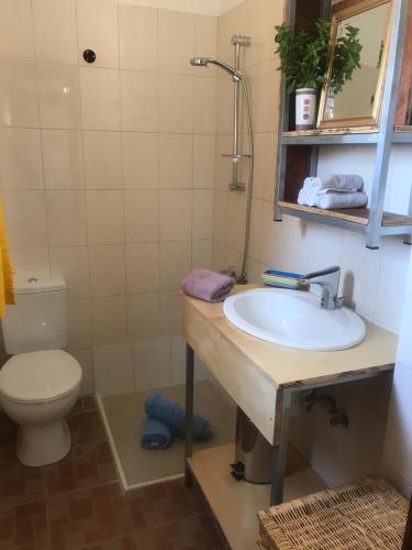 a bathroom with a sink and a toilet at MP Cozy Apartment Near the Sea in Paphos City