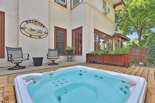 a jacuzzi tub in the yard of a house at The Lancaster Manor Bed and Breakfast in Gainesville