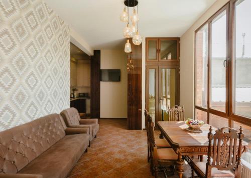 a living room with a couch and a table at Brick walls in Gori
