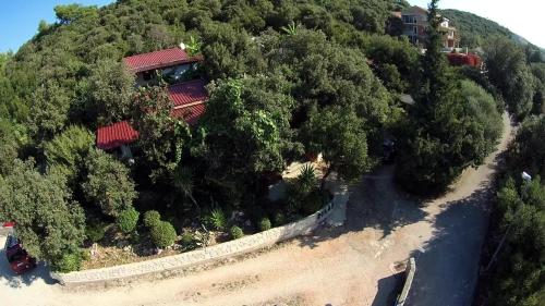 an aerial view of a house on a hill with trees at Relax tiny villas 40 meters of the beach in Korčula