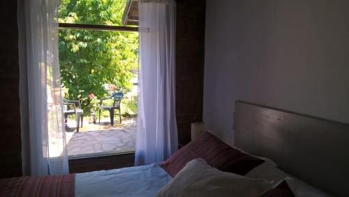 Giường trong phòng chung tại Departamento estudio Gnomos 1