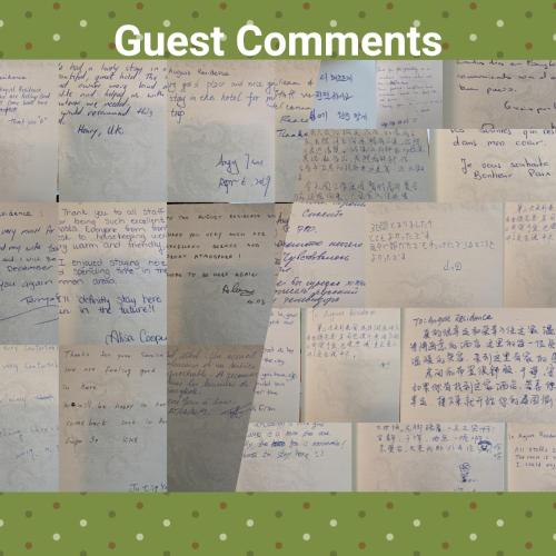 a bunch of handwritten documents on a wall at August Residence in Bangkok