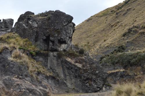 a large rock on the side of a mountain at Hostal Kuyllur Ñan in Zumbahua