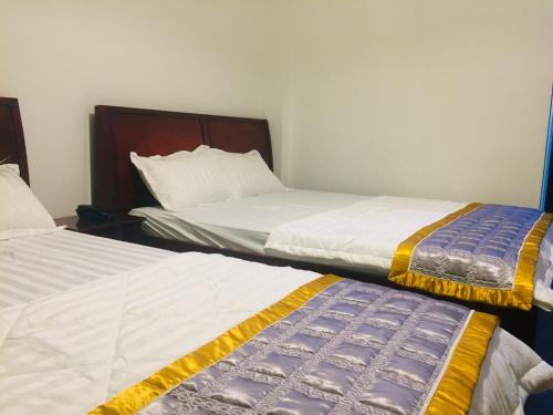 Ένα ή περισσότερα κρεβάτια σε δωμάτιο στο Nam Phương Hotel Sa Đéc