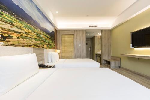 Atour Hotel Xi'an (Wenjing Road, North 2nd Ring Roadにあるベッド