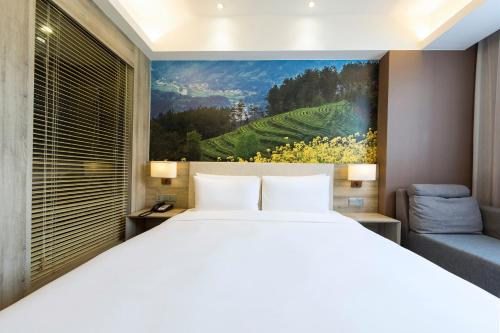 Atour Hotel Xi'an (Wenjing Road, North 2nd Ring Roadにあるベッド