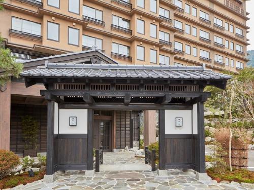 a building with a gate in front of a building at Yukinohana in Yuzawa