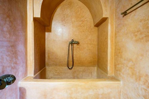 a bathroom with a shower with a tub at Palacio Conde de Cabra in Granada