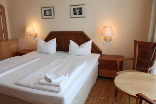 Postel nebo postele na pokoji v ubytování Hotel Stolteraa
