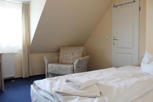 Postel nebo postele na pokoji v ubytování Hotel Stolteraa