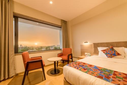 Una cama o camas en una habitación de Hotel Antra Inn