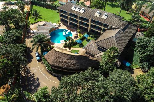 an overhead view of a house with a swimming pool at Dolphin Suites in Kampala