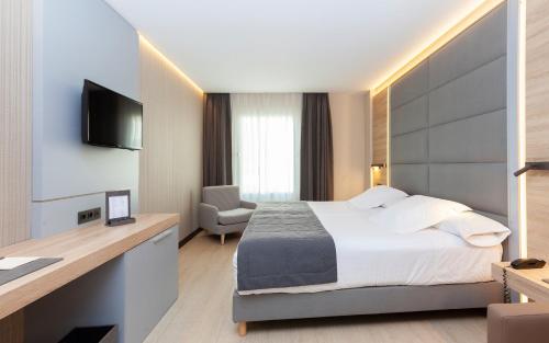 Ένα ή περισσότερα κρεβάτια σε δωμάτιο στο Hotel Liabeny