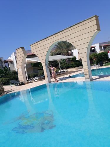 a woman is standing in a swimming pool at Sunrise Beach Club (Hera B6@) in Kalecik