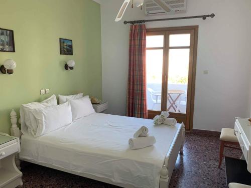 Postel nebo postele na pokoji v ubytování Minoa Hotel