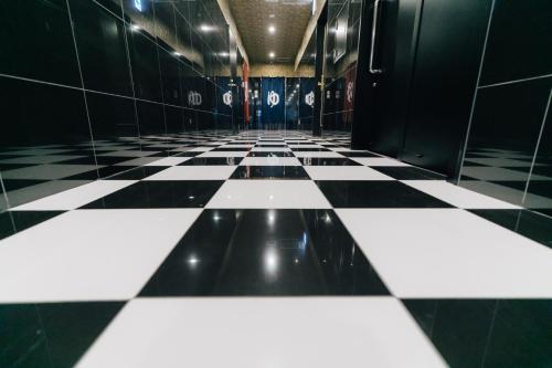 a black and white checkered floor in a bathroom at The Celecton Kurashiki Mizushima in Kurashiki