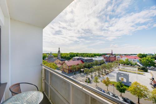 a balcony with a view of a city at Pärnu Hotel in Pärnu