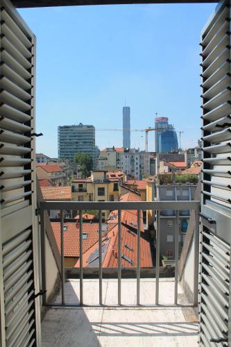 a view of a city from a balcony at Hotel Mozart in Milan
