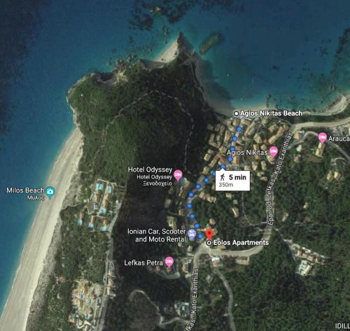 a map of a beach with pink dots at Eolos Apartments with Private Parking in Agios Nikitas