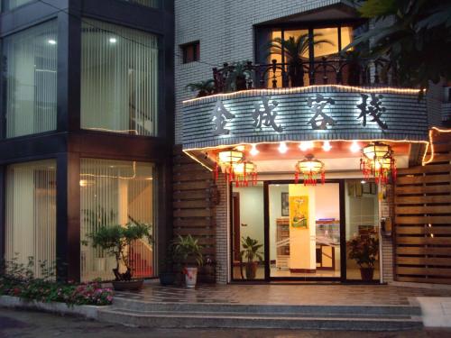 a building with a balcony with lights on it at King Town Hotel in Luodong