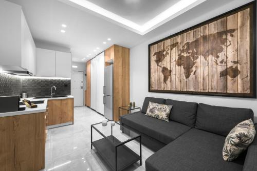 a living room with a couch and a map on the wall at #Luxlikehome - Cozy Living Thessaloniki in Thessaloniki
