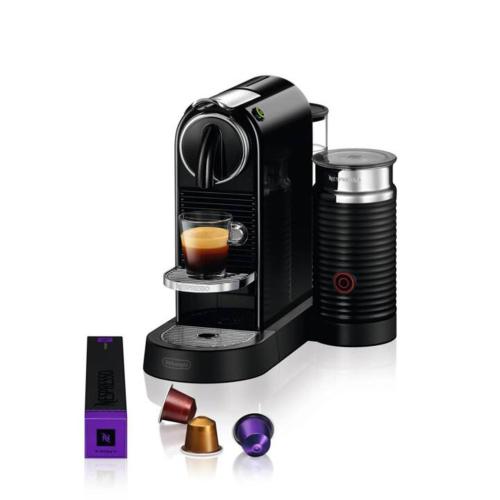 a coffee maker with a cup of coffee at Ferienwohnungen Thum in Rosenheim