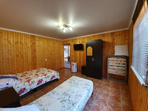 Ένα ή περισσότερα κρεβάτια σε δωμάτιο στο Guesthouse Kurortnaya 46