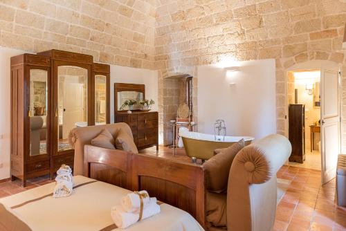 a living room with a tub and a sink at Masseria Santo Stefano Relais&Charming House in Conversano