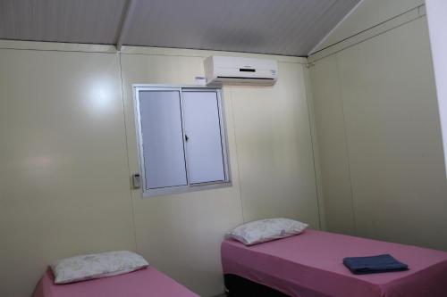 Giường trong phòng chung tại Casa mobiliada