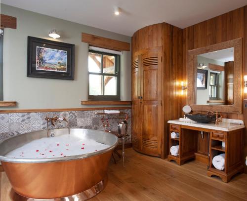 a large bathroom with a tub and a sink at Black Horse Beamish in Stanley
