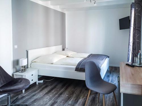 Ένα ή περισσότερα κρεβάτια σε δωμάτιο στο Hotel Garni Landhaus zur Issel