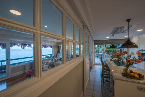 a dining room with a view of the ocean at VILLA EMBIL GETARIA in Getaria