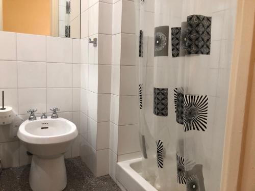 a bathroom with a toilet and a sink and a shower at LIGURIA HOLIDAYS - "La Casa di Gisella" in Camogli