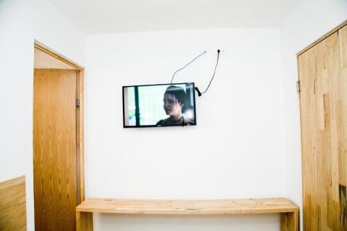 a television hanging on a wall in a room at Booking 500 in Monterrey