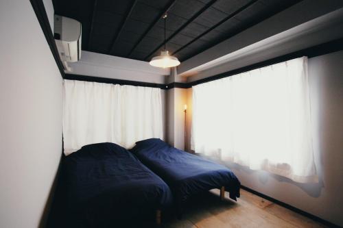 Tempat tidur dalam kamar di Beppu hostel&cafe ourschestra - Vacation STAY 45855