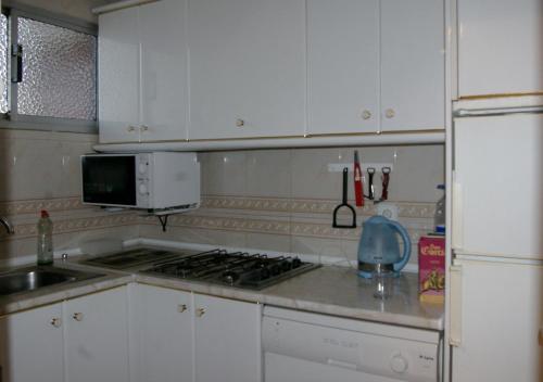 Una cocina o zona de cocina en Apartamentos Carolina - Arca Rent