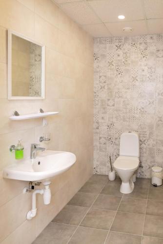 a bathroom with a sink and a toilet at Mia Guesthouse in Haljala