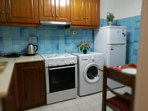 Kuchyň nebo kuchyňský kout v ubytování Platos Academy Apartment