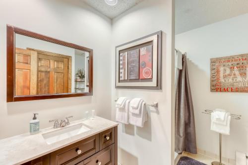 a bathroom with a sink and a mirror at Sunrise: West Glade-J2 in Killington