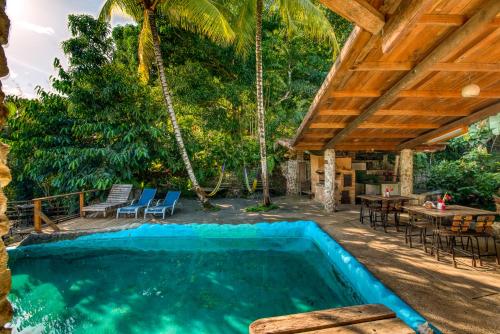 The swimming pool at or near Omega Tours Eco-Jungle Lodge