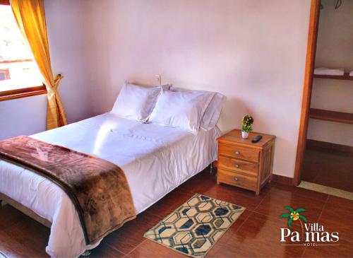 Katil atau katil-katil dalam bilik di Hotel Villa Palmas