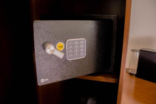 a box with a remote control on a shelf at Casa San Miguel Hotel Boutique y Spa in Zacatlán