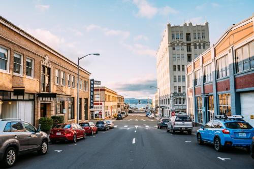 a city street with cars parked on the street at Norblad Hotel in Astoria, Oregon